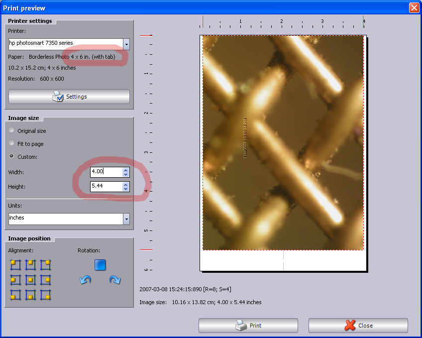 Paper size is 4x6 inches plus a tab at one end, for a total of 4x6.5. When custom width is set to 4 inches, though, it shows a boarder on either side of the picture. (Plus a small boarder on the top of the image when alignment was set to center-top.)